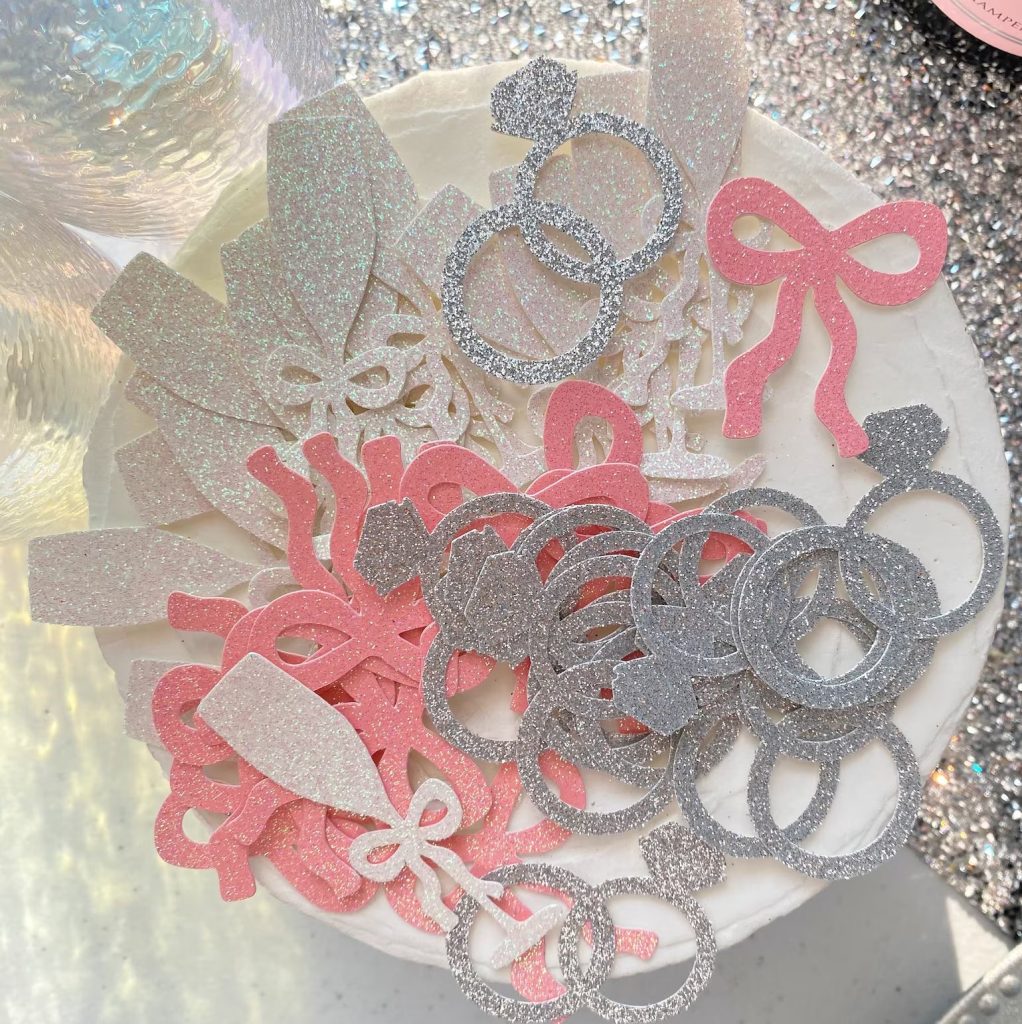 Pink Bow, wedding rings,  & Champlagne flutes Confettii