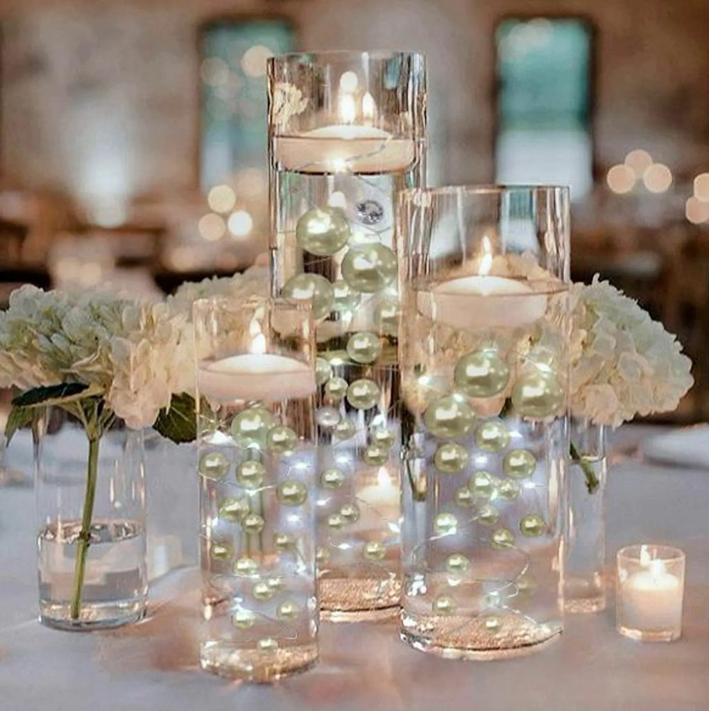 Floating pearl centerpiece showcasing Pearlcore wedding decor trends