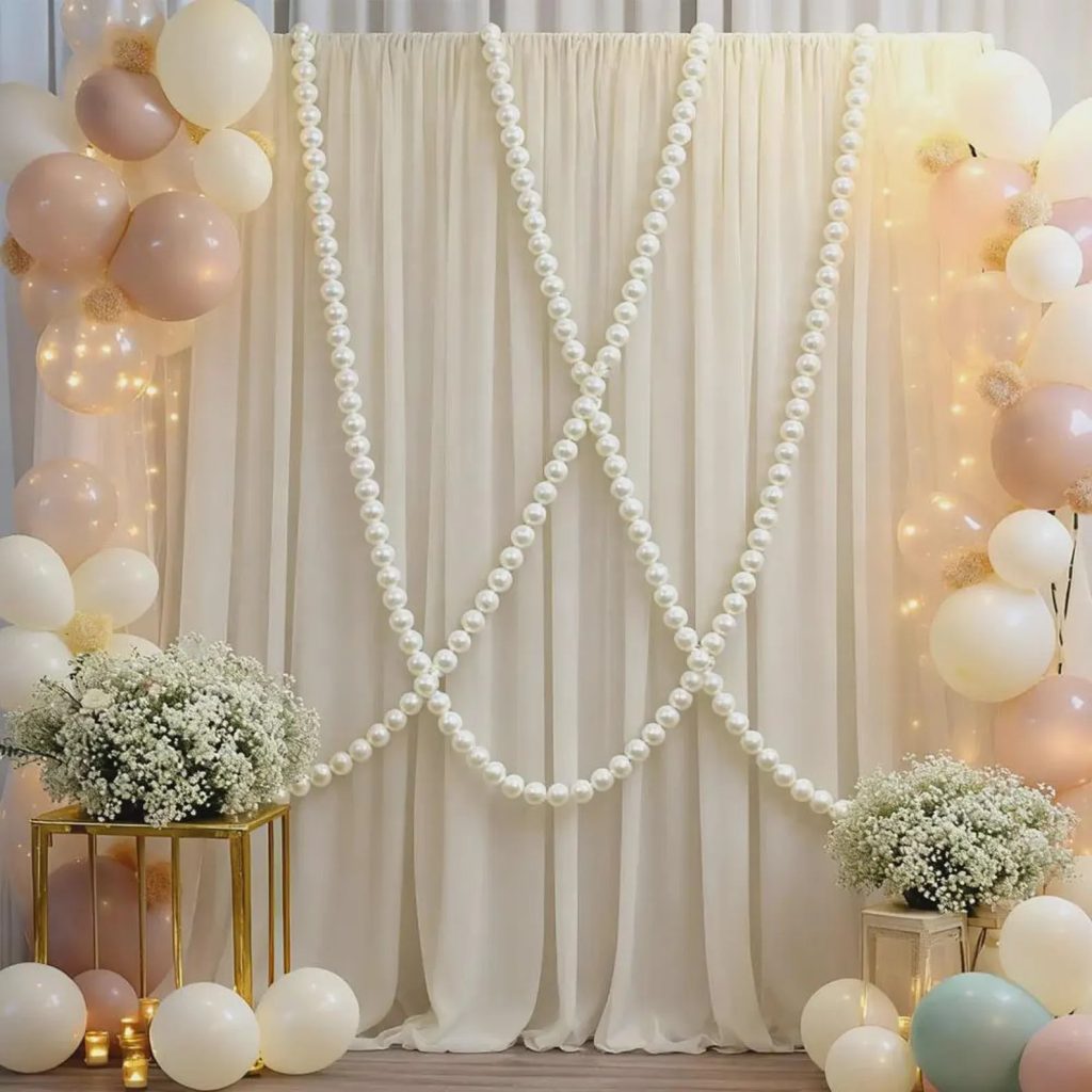 Pearlcore wedding decor trends featuring a romantic pearl arch
